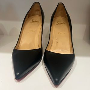 Black Louboutin pumps